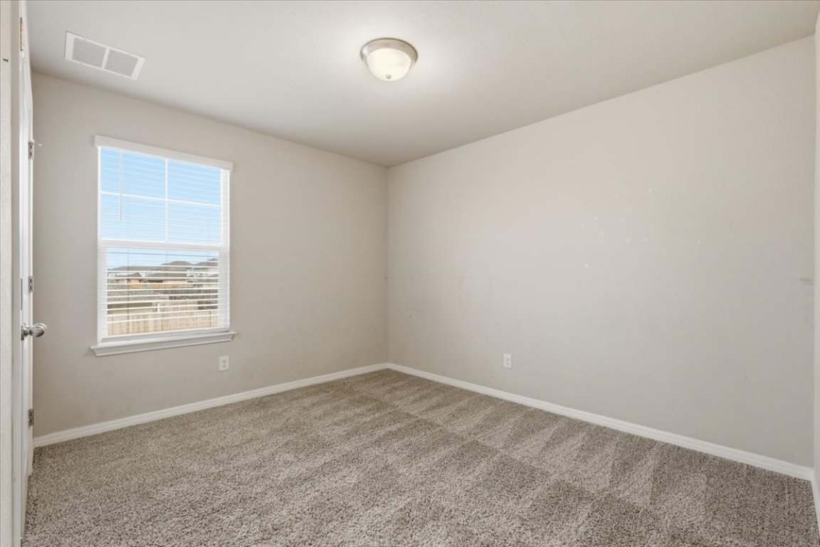 17705 Prairie Land Way Manor, TX 78653 - Photo 18 of 29 an empty room with a window