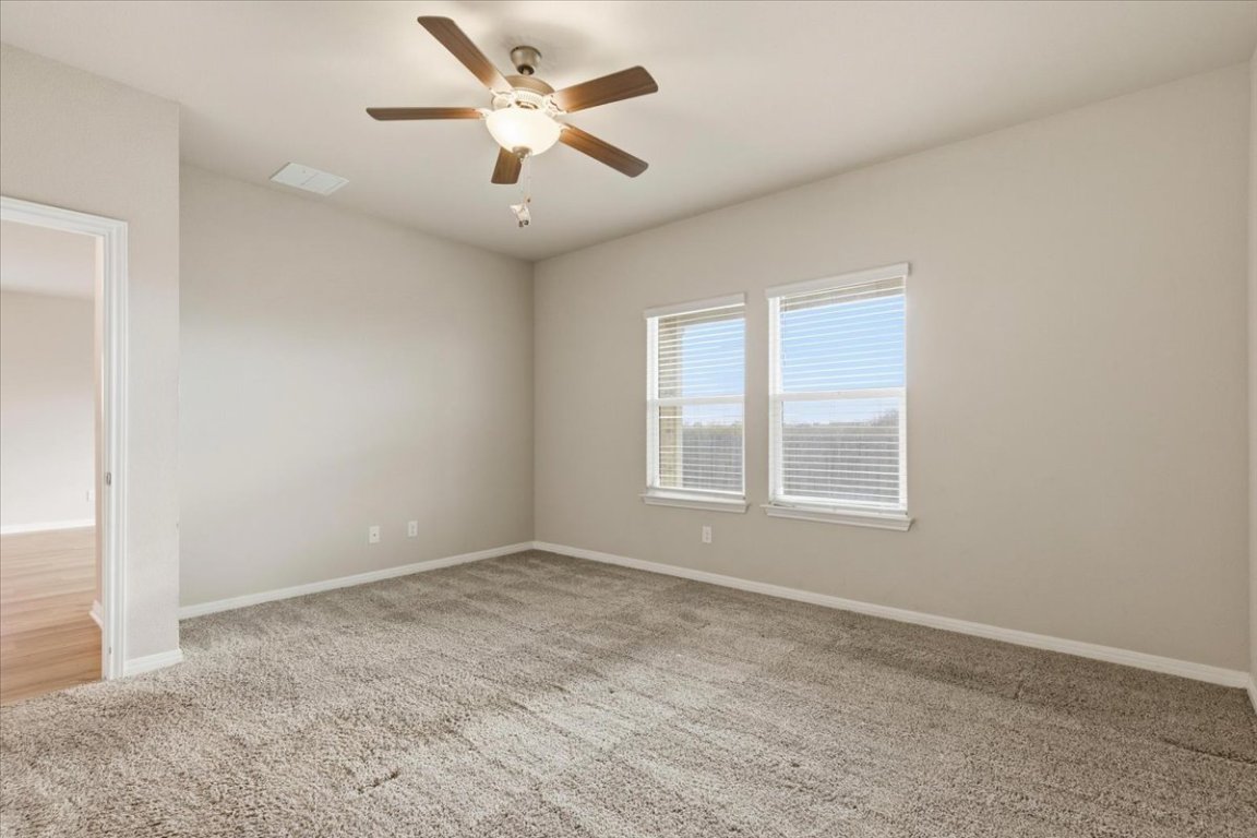 17705 Prairie Land Way Manor, TX 78653 - Photo 9 of 29 an empty room with a window