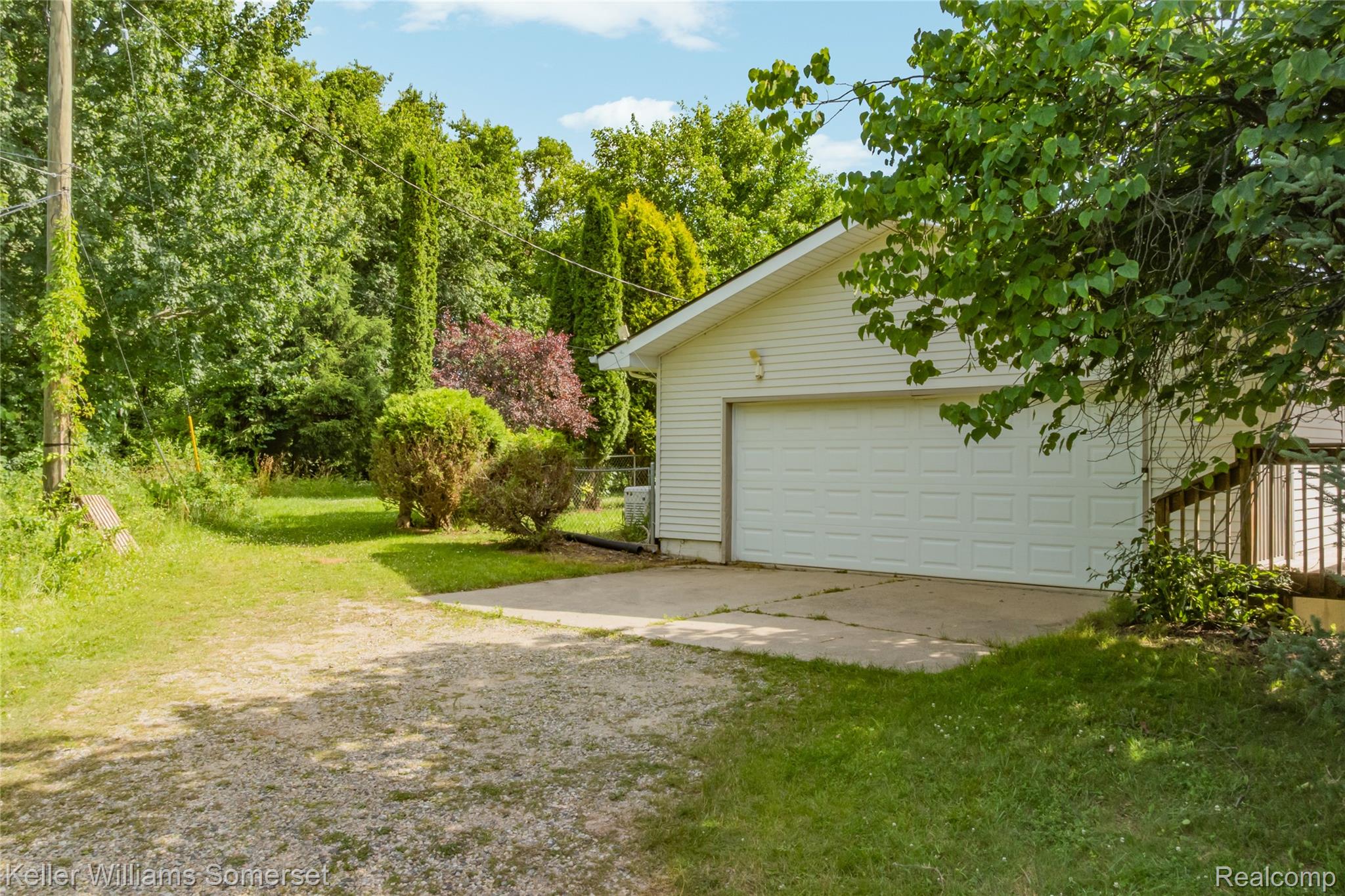 2344 Rochester Road Leonard, MI 48367 - Photo 54 of 66 Attached garage with white panel door