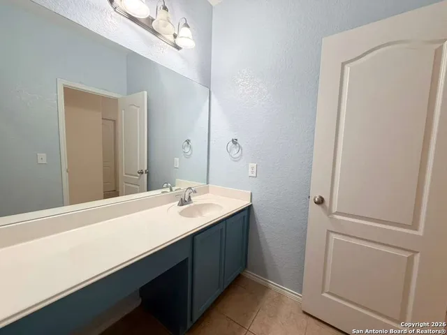 a white toilet sitting next to a white tub