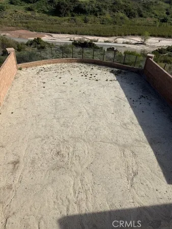 a view of a backyard of a house with lots of green space