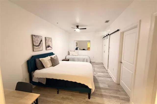 a bedroom with bed and a window