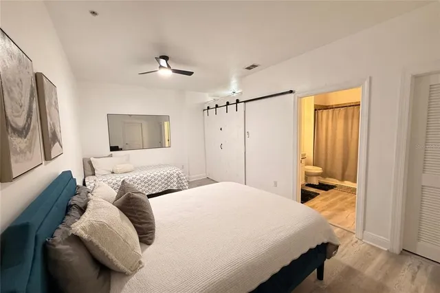 a bedroom with a large bed and a window