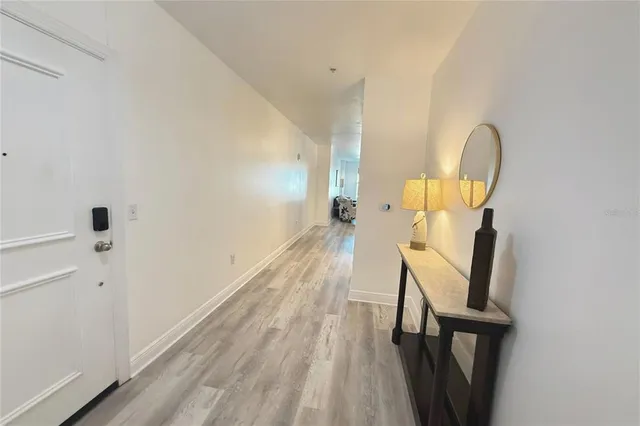 a view of entryway with wooden floor