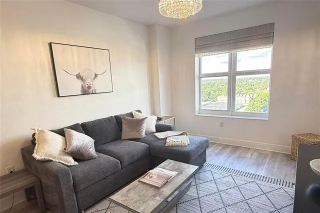 a living room with furniture and a window