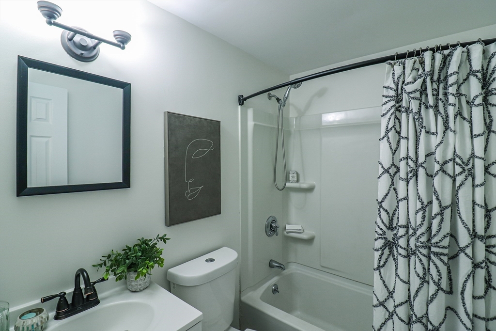 1114 Allen Street Springfield, MA 01118 - Photo 20 of 25 a bathroom with a shower a toilet and sink