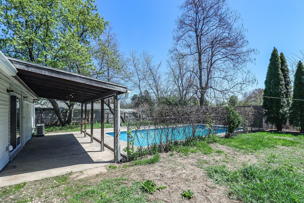 1114 Allen Street Springfield, MA 01118 - Photo 23 of 25 a view of backyard with table and chairs and a fire pit