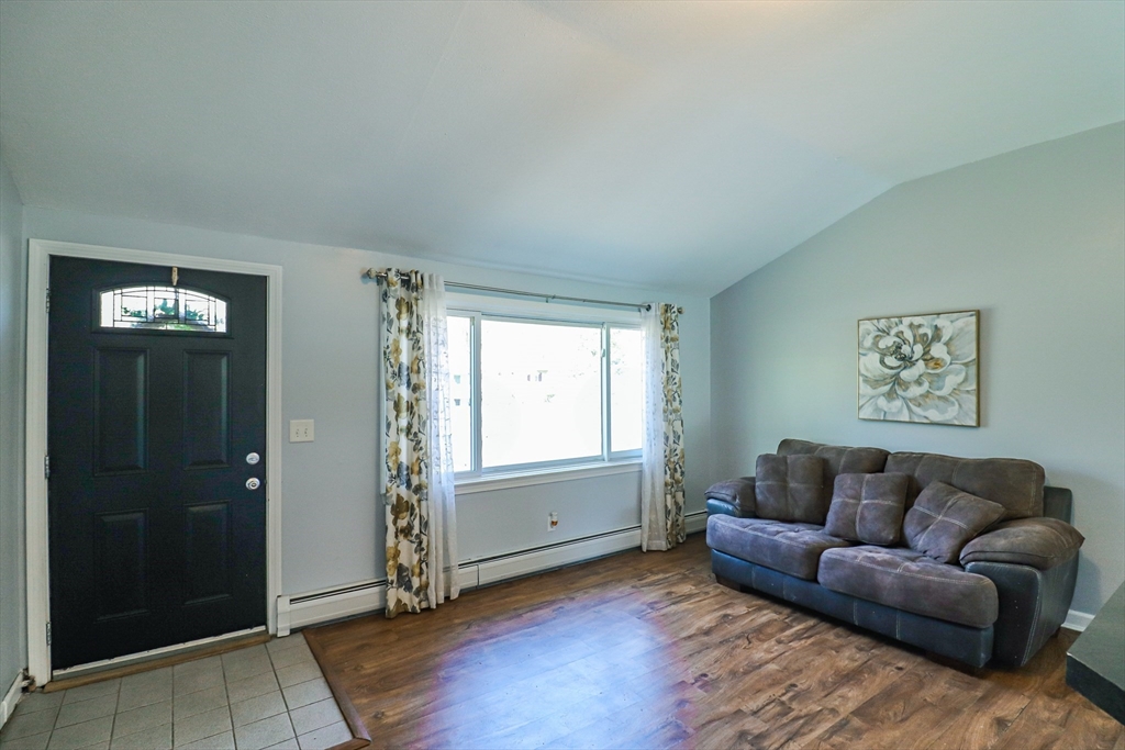 1114 Allen Street Springfield, MA 01118 - Photo 7 of 25 a living room with furniture and a window