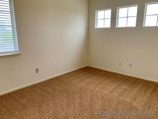 6921 Catamaran Drive Carlsbad, CA 92011 - Photo 11 of 26 an empty room with a window