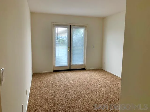 6921 Catamaran Drive Carlsbad, CA 92011 - Photo 12 of 26 an empty room with windows