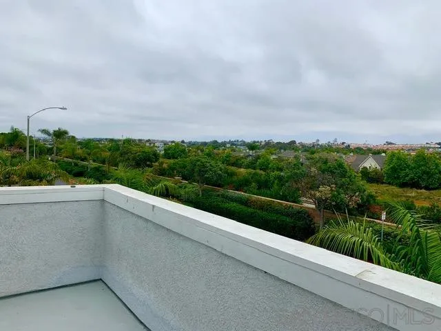 6921 Catamaran Drive Carlsbad, CA 92011 - Photo 14 of 26 a view of balcony with yard and green space