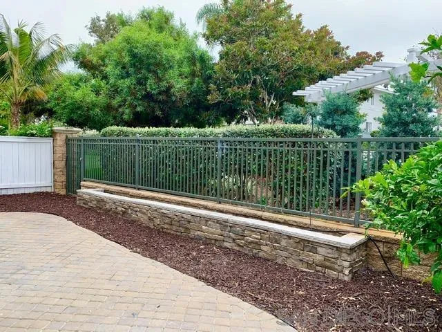6921 Catamaran Drive Carlsbad, CA 92011 - Photo 17 of 26 a backyard of a house with lots of green space