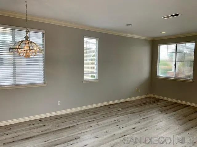 6921 Catamaran Drive Carlsbad, CA 92011 - Photo 25 of 26 a view of wooden floor and windows in a room