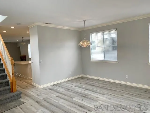 6921 Catamaran Drive Carlsbad, CA 92011 - Photo 26 of 26 wooden floor in an empty room with a window