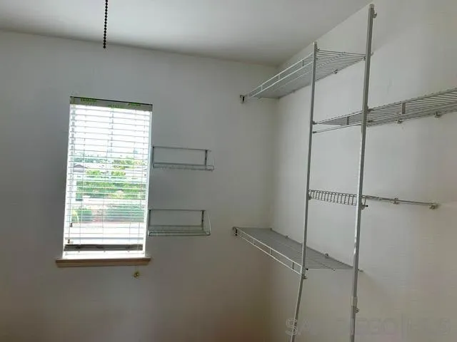 6921 Catamaran Drive Carlsbad, CA 92011 - Photo 5 of 26 a view of an empty room with a window