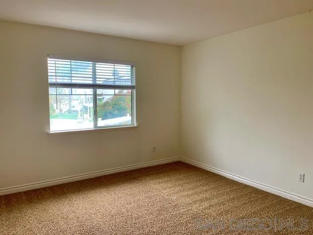 6921 Catamaran Drive Carlsbad, CA 92011 - Photo 8 of 26 an empty room with a window