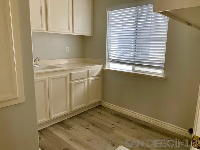 6921 Catamaran Drive Carlsbad, CA 92011 - Photo 9 of 26 a view of a utility room with a sink
