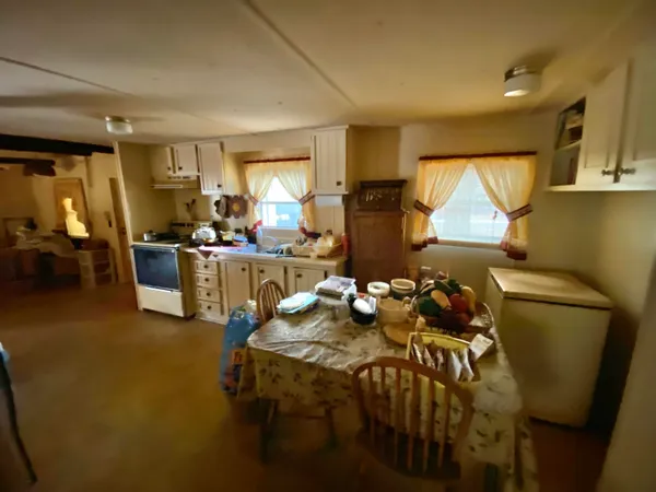 a living room with furniture a window and gym equipment