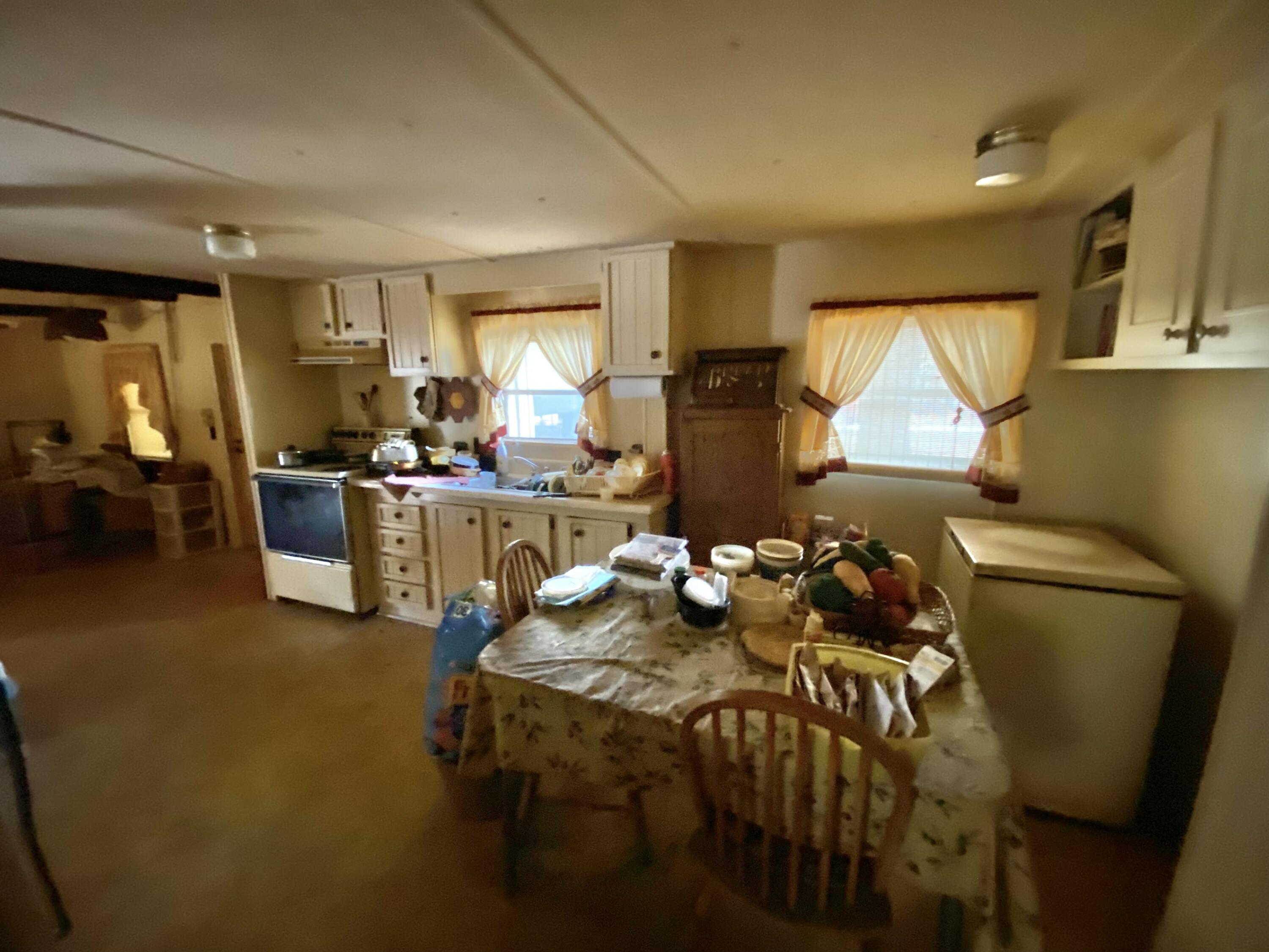 3210 Wells Avenue Crestview, FL 32539 - Photo 18 of 21 a living room with furniture a window and gym equipment