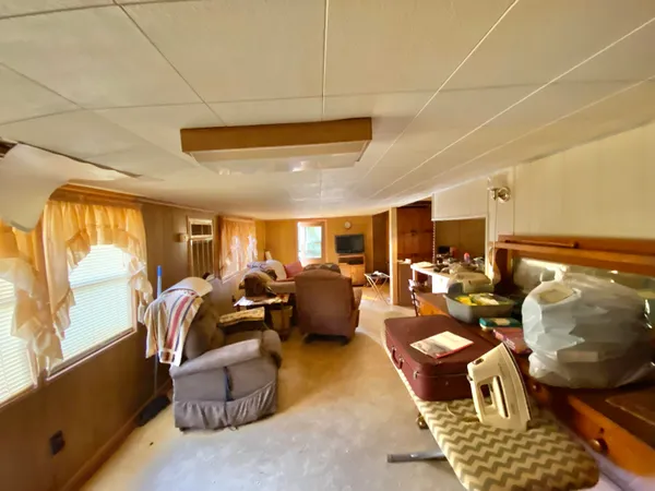 a very nice looking living room with a couch and a large window