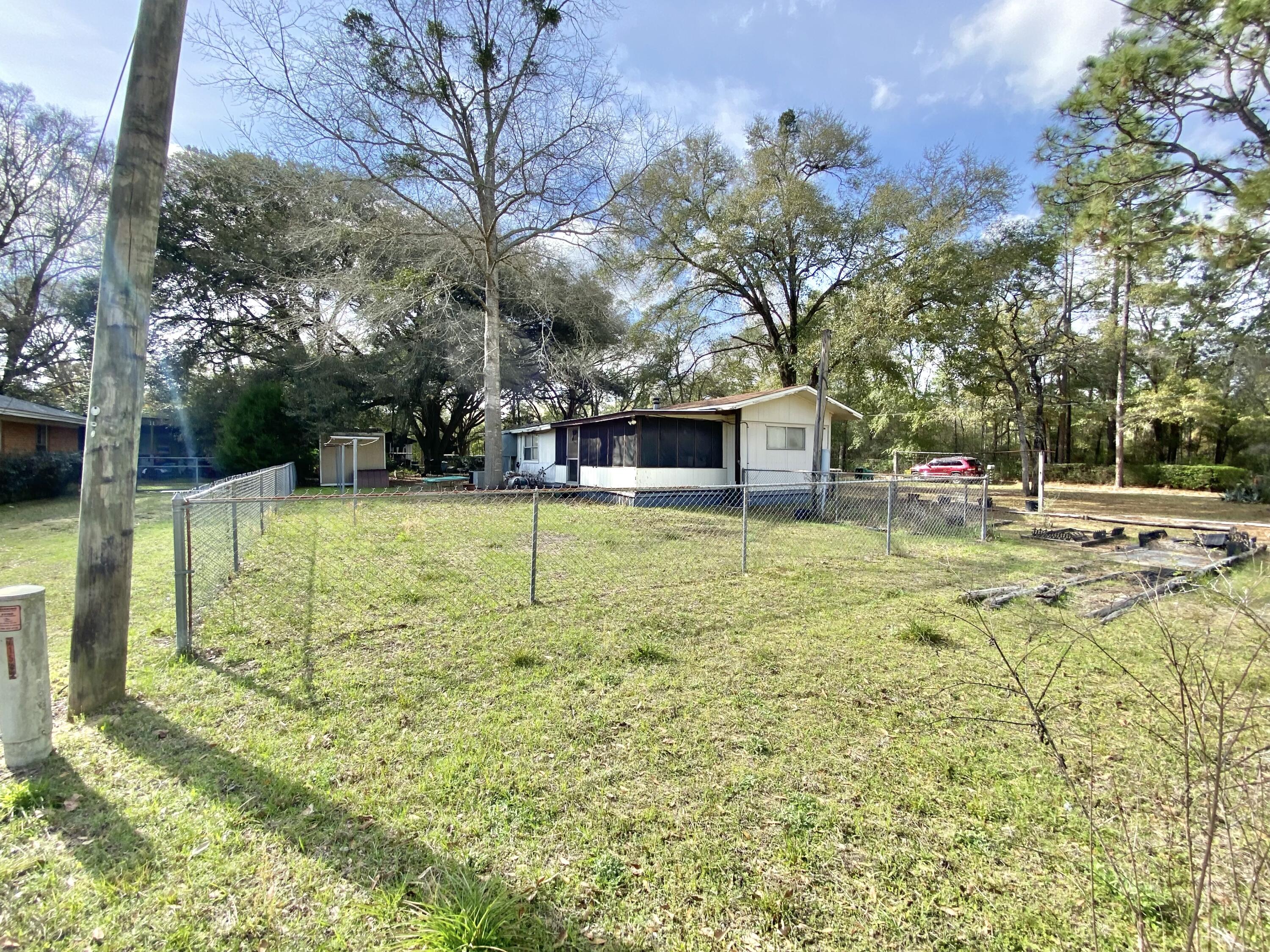 3210 Wells Avenue Crestview, FL 32539 - Photo 6 of 21 a view of a house with a yard