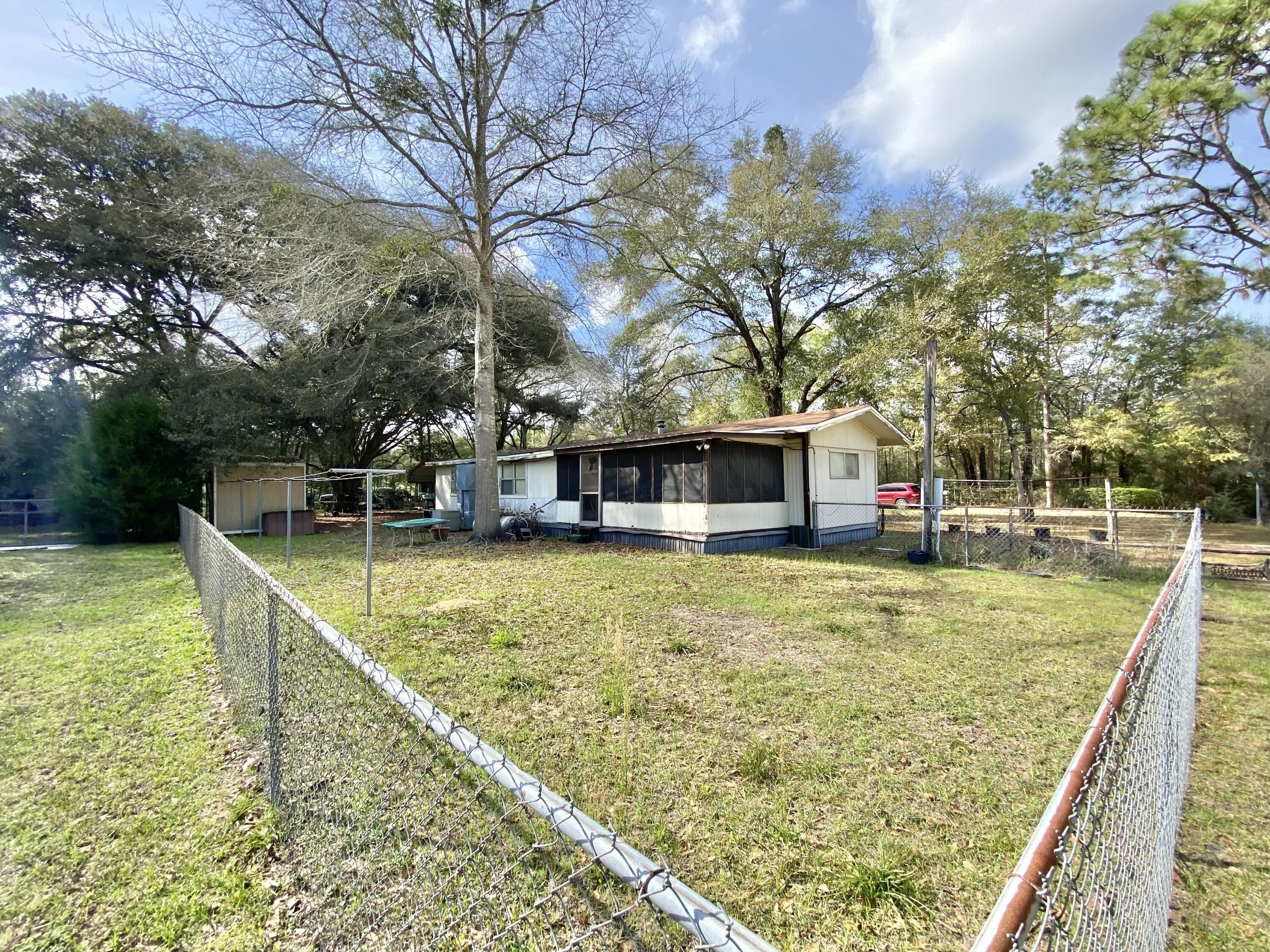 3210 Wells Avenue Crestview, FL 32539 - Photo 7 of 21 a view of a house with swimming pool