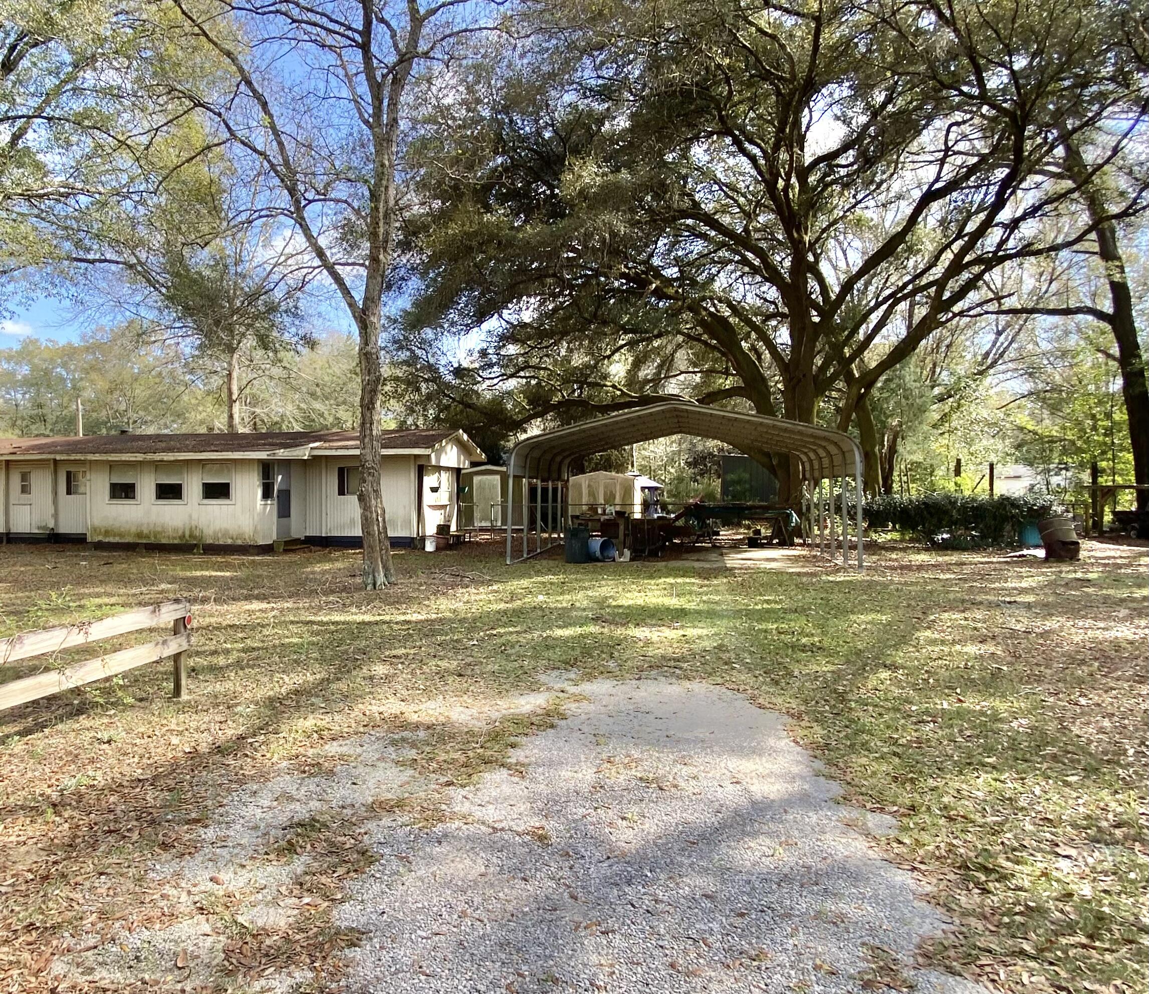 3210 Wells Avenue Crestview, FL 32539 - Photo 10 of 21 a view of a swimming pool with tree s
