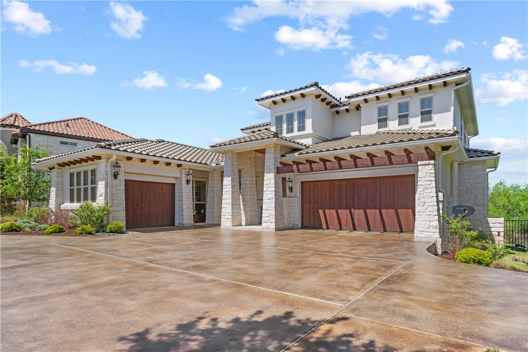 102 Barbuda Drive Lakeway, TX 78734 - Photo 1 of 1 a front view of a house with a garden
