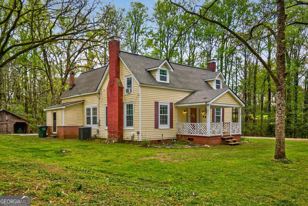 2051 Emmett Doster Road Northwest Monroe, GA 30656 - Photo 1 of 50 a front view of house with yard and green space