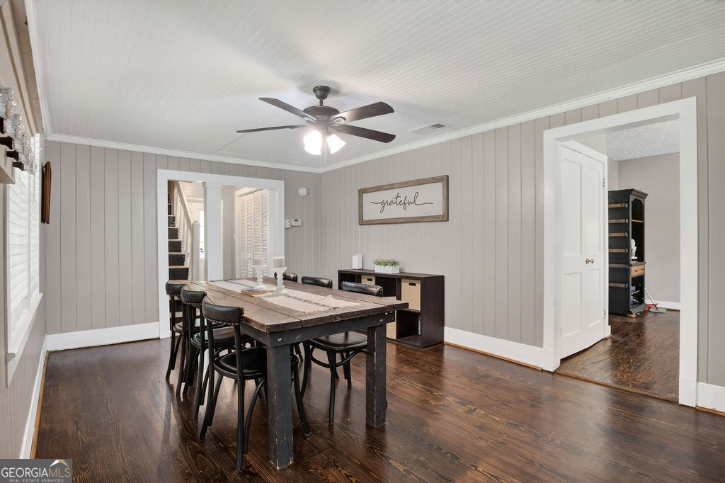 2051 Emmett Doster Road Northwest Monroe, GA 30656 - Photo 16 of 50 a view of a dining room with furniture and wooden floor