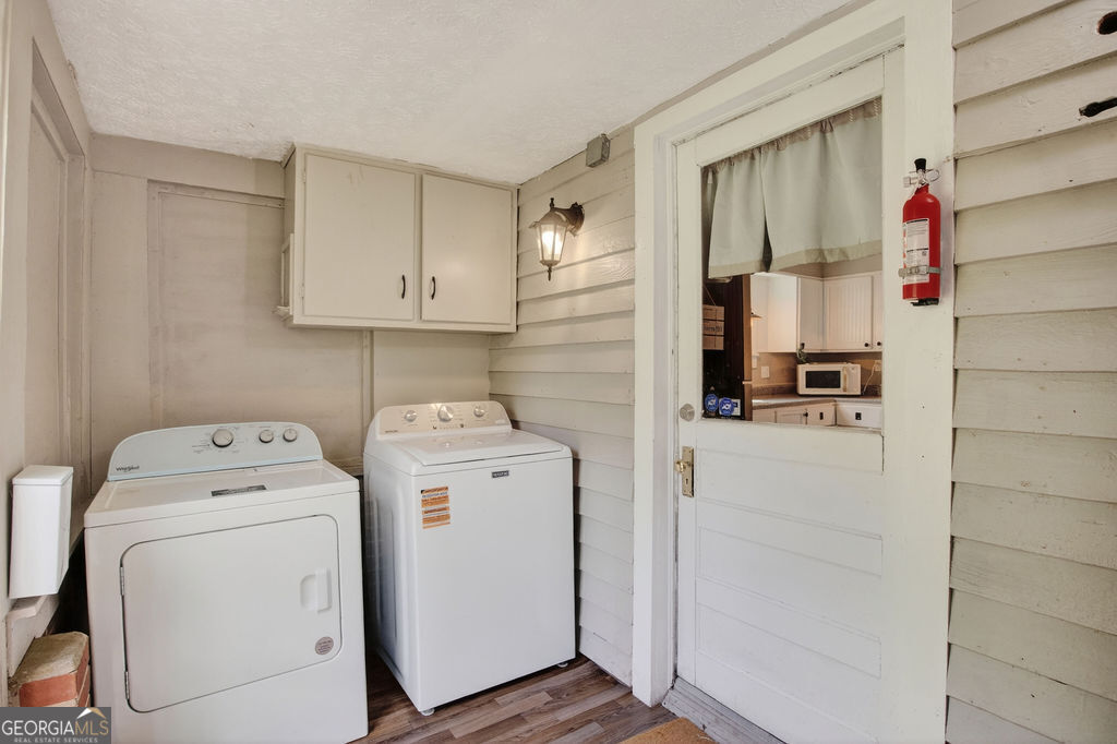2051 Emmett Doster Road Northwest Monroe, GA 30656 - Photo 18 of 50 a utility room with dryer and washer