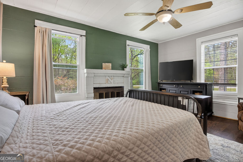 2051 Emmett Doster Road Northwest Monroe, GA 30656 - Photo 19 of 50 a bedroom with a bed and a flat screen tv