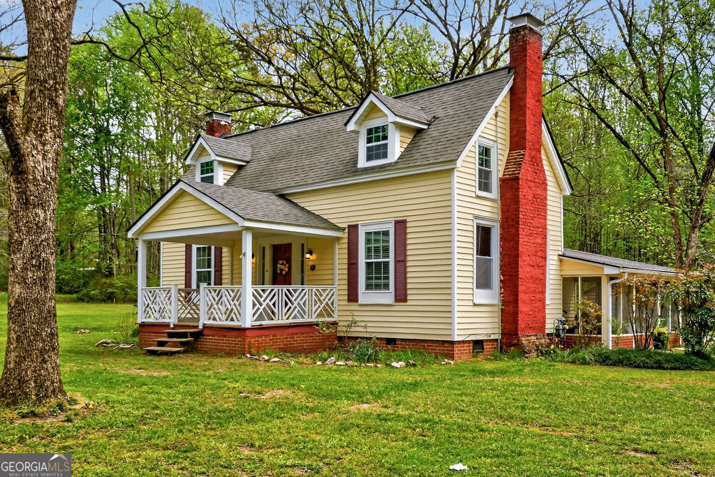 2051 Emmett Doster Road Northwest Monroe, GA 30656 - Photo 2 of 50 a view of a house with a yard