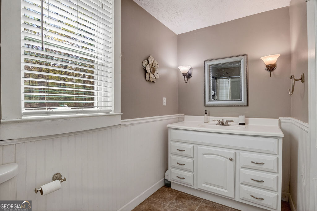 2051 Emmett Doster Road Northwest Monroe, GA 30656 - Photo 21 of 50 a bathroom with a sink and a mirror