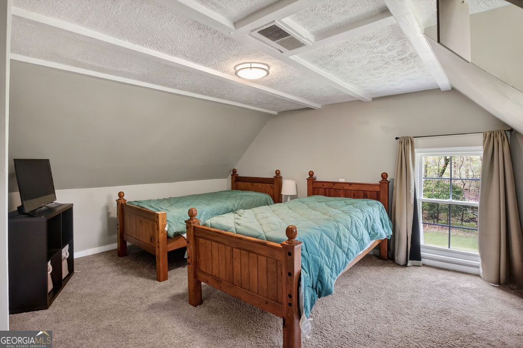 2051 Emmett Doster Road Northwest Monroe, GA 30656 - Photo 24 of 50 a bedroom with bed and a window