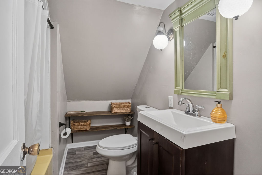 2051 Emmett Doster Road Northwest Monroe, GA 30656 - Photo 26 of 50 a bathroom with a sink toilet and mirror
