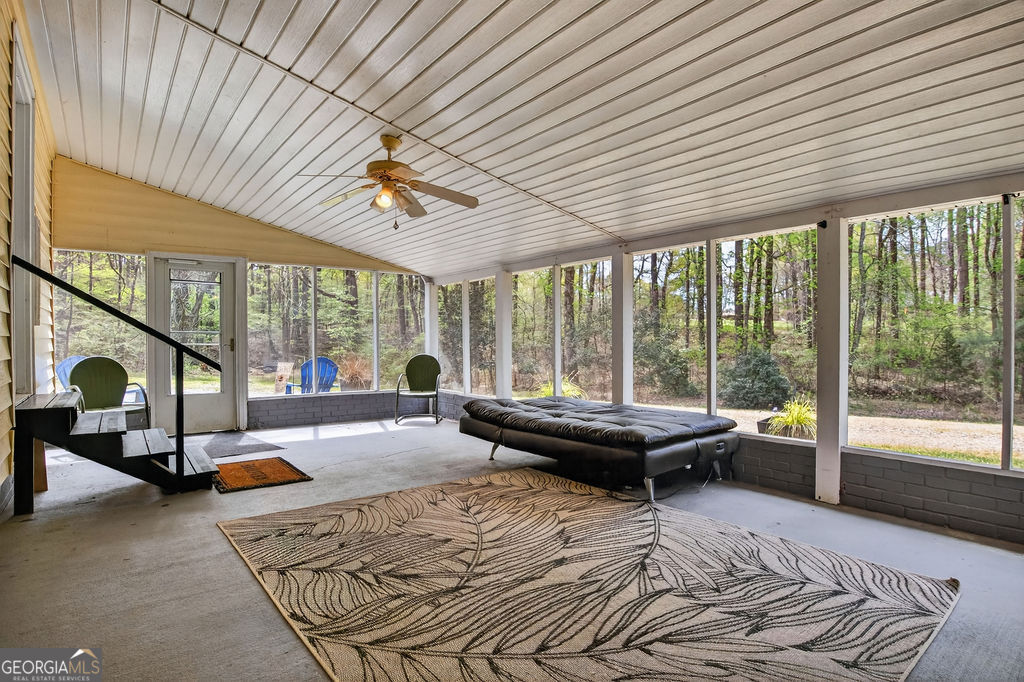 2051 Emmett Doster Road Northwest Monroe, GA 30656 - Photo 30 of 50 a bed sitting in a room next to a large window