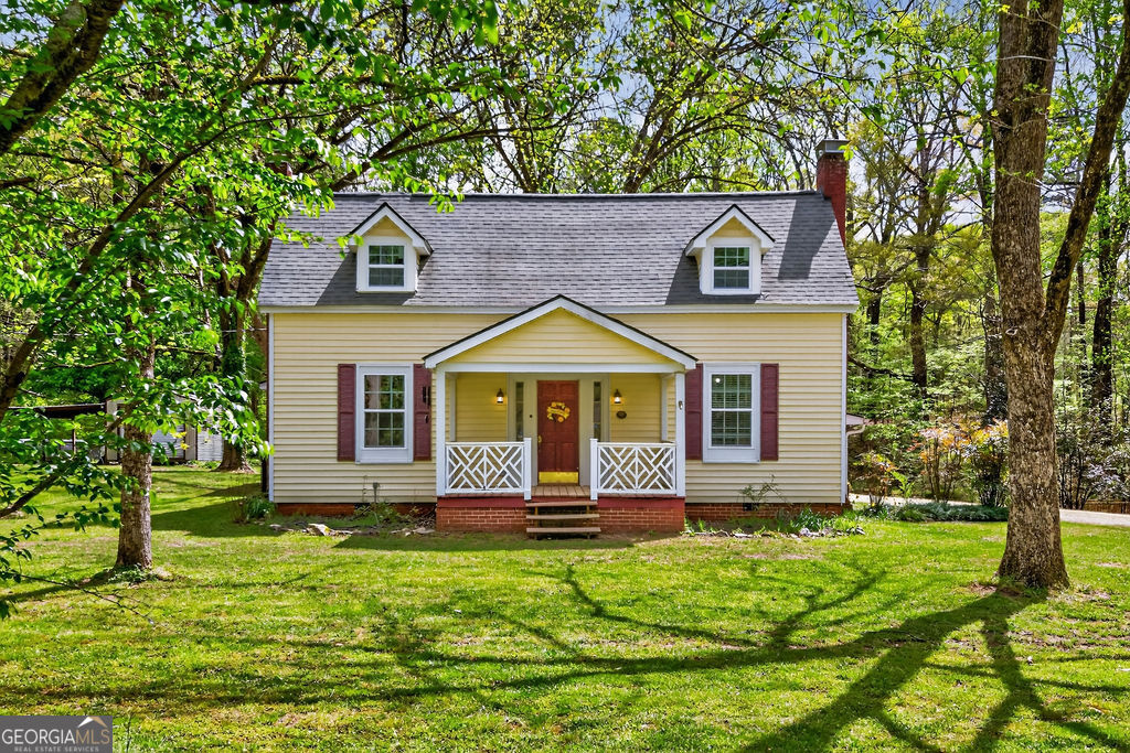 2051 Emmett Doster Road Northwest Monroe, GA 30656 - Photo 3 of 50 a front view of a house with a yard