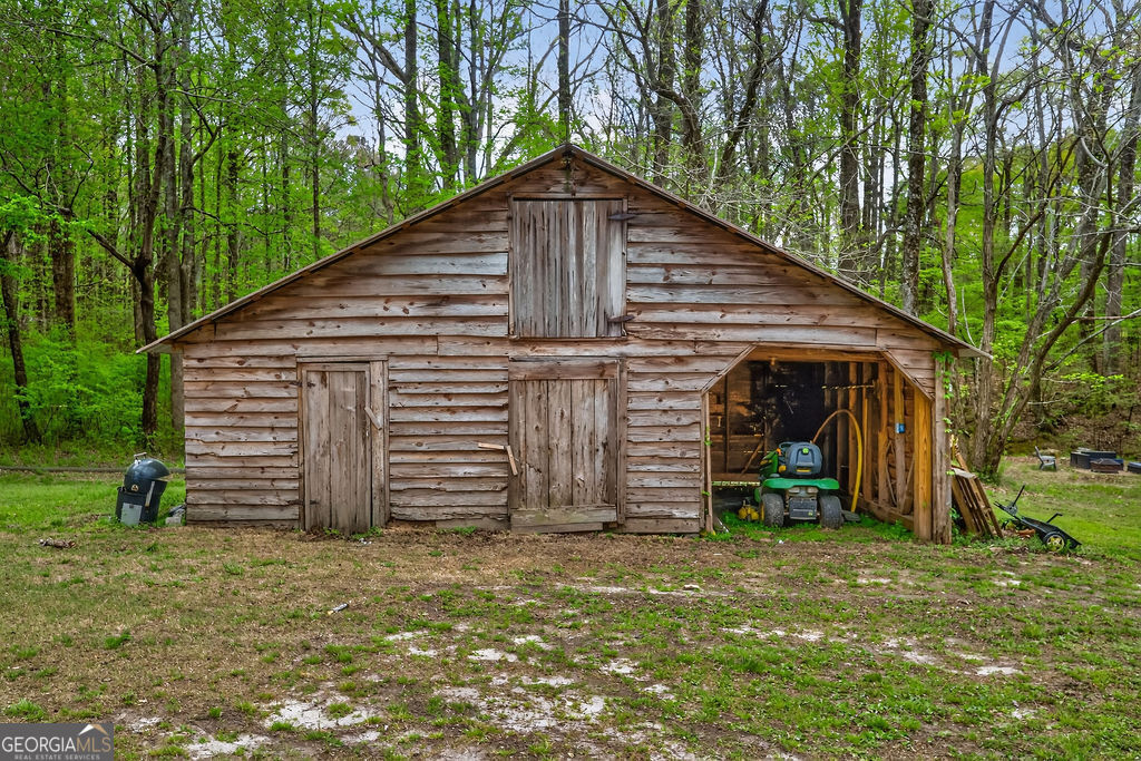 2051 Emmett Doster Road Northwest Monroe, GA 30656 - Photo 40 of 50 a backyard of a house with barbeque oven