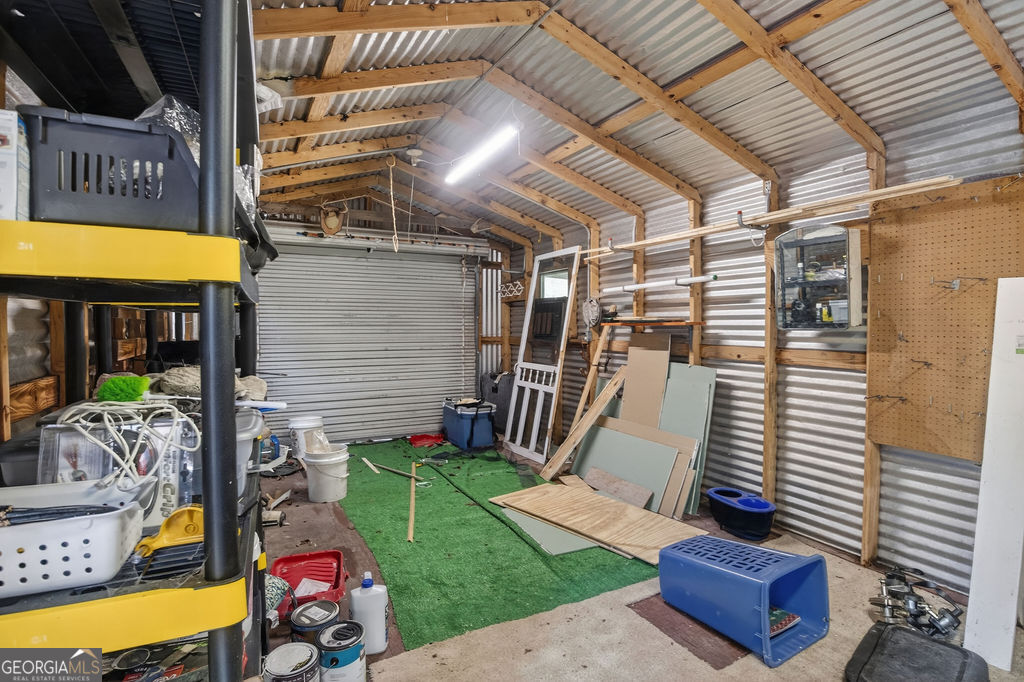 2051 Emmett Doster Road Northwest Monroe, GA 30656 - Photo 44 of 50 a view of a chairs and table in a patio