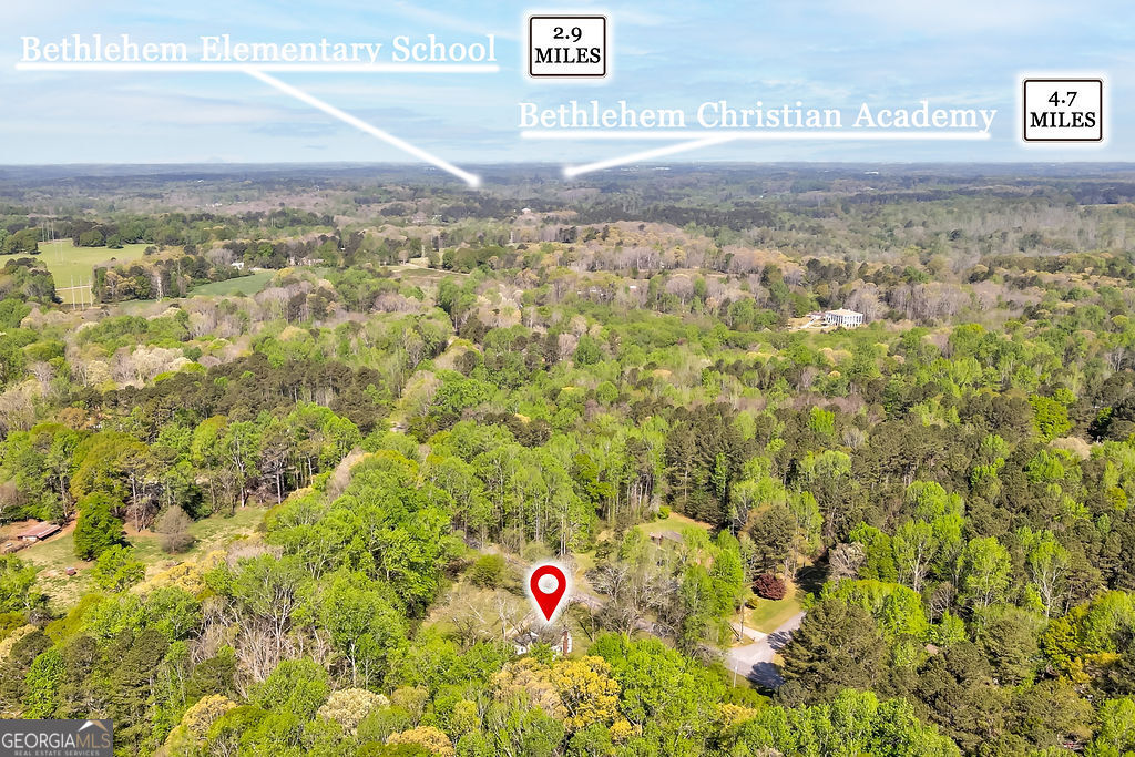 2051 Emmett Doster Road Northwest Monroe, GA 30656 - Photo 45 of 50 a view of outdoor space with trees all around