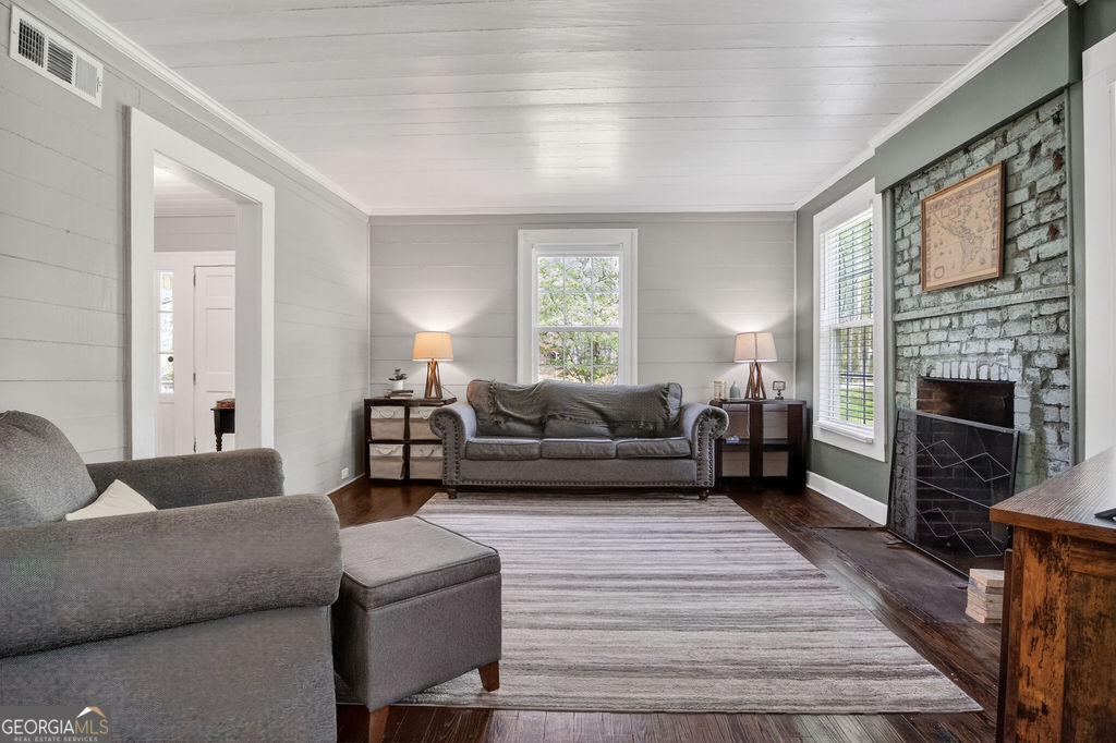 2051 Emmett Doster Road Northwest Monroe, GA 30656 - Photo 6 of 50 a living room with furniture and a fireplace