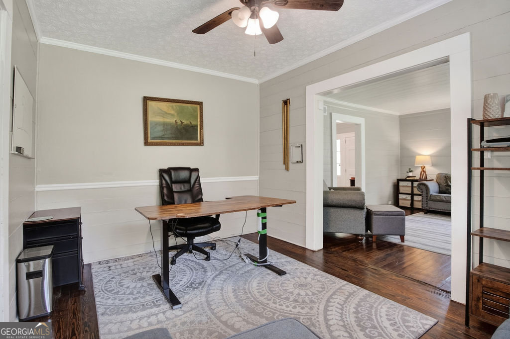 2051 Emmett Doster Road Northwest Monroe, GA 30656 - Photo 8 of 50 a view of a livingroom with workspace and a couch