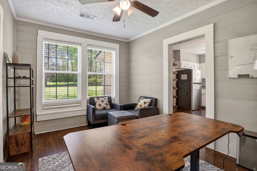 2051 Emmett Doster Road Northwest Monroe, GA 30656 - Photo 9 of 50 a bed sitting in a bedroom next to a window