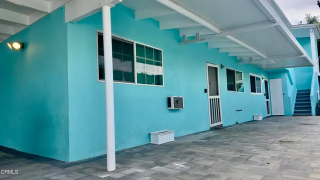 a view of an empty room with windows