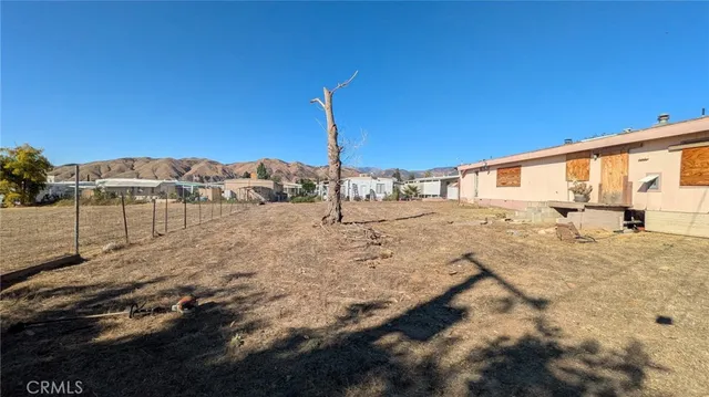 a view of a backyard of the house
