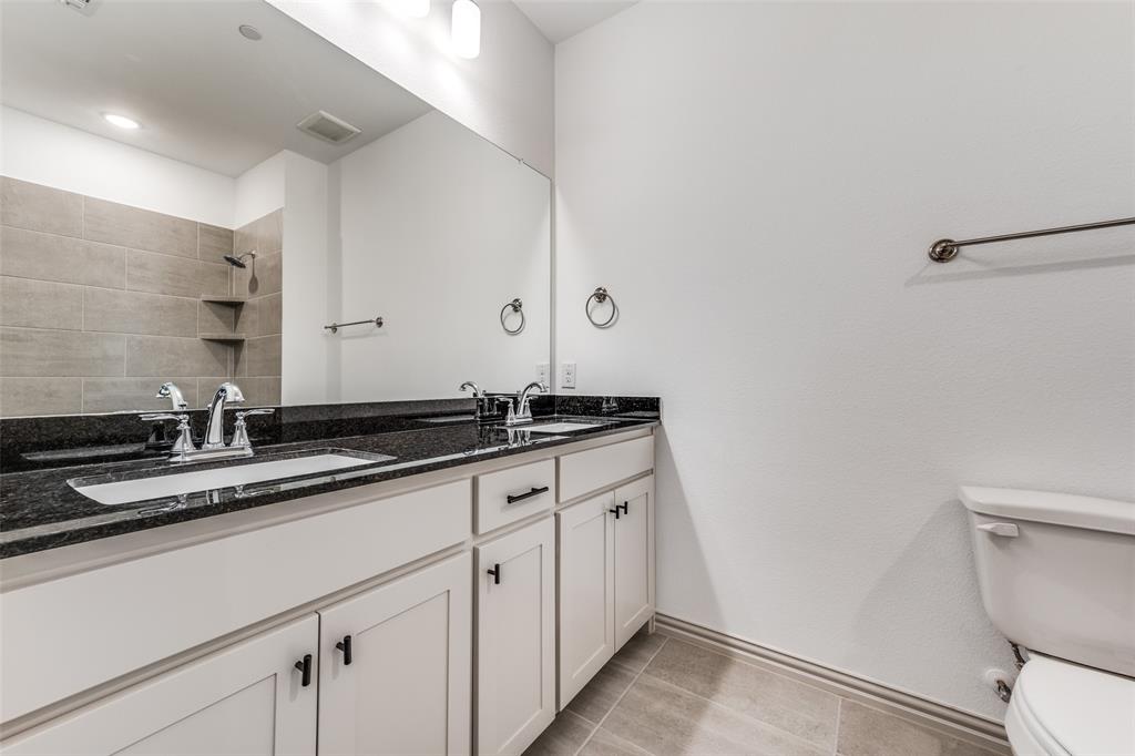 15866 Yellow Elder Road Frisco, TX 75035 - Photo 20 of 25 a bathroom with a sink and a toilet