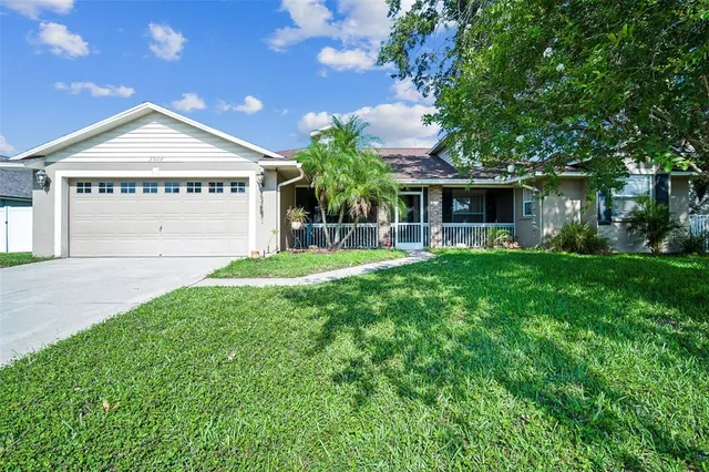 a front view of house with yard and green space