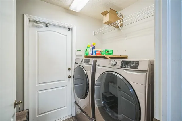 a kitchen with stainless steel appliances granite countertop a stove sink and cabinets