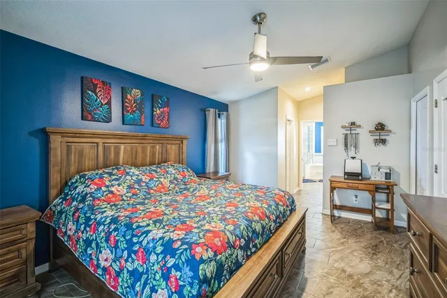 a bedroom with bed and a window